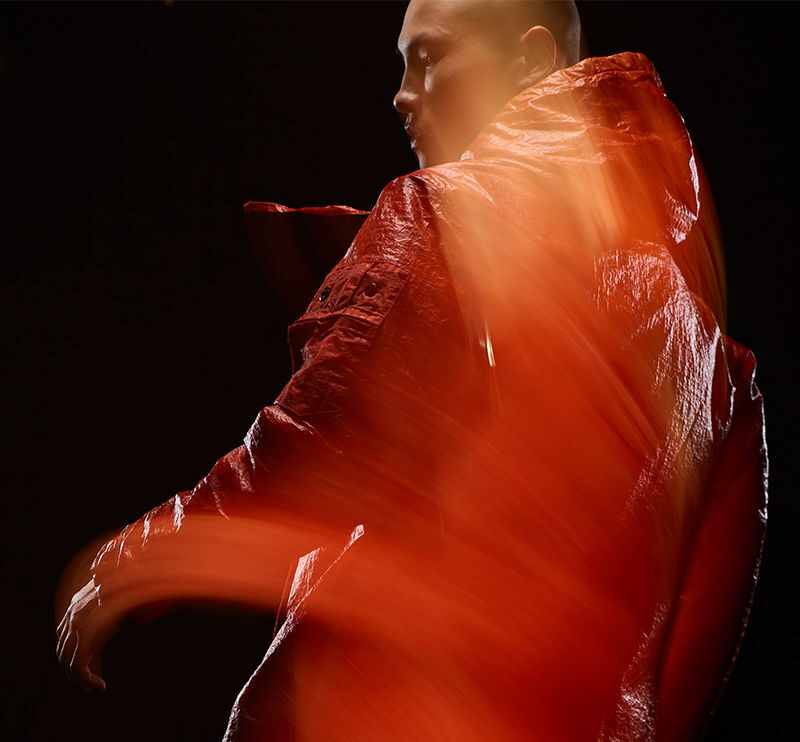 techwear man in blurred motion