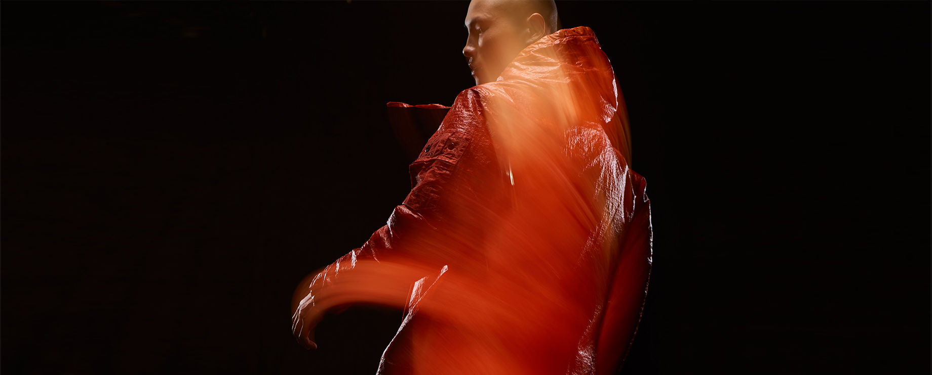 techwear man in blurred motion